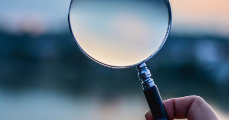 Research - Selective Focus Photo of Magnifying Glass