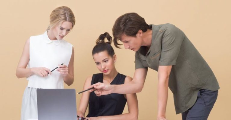 Feedback - Colleagues Looking at Laptop